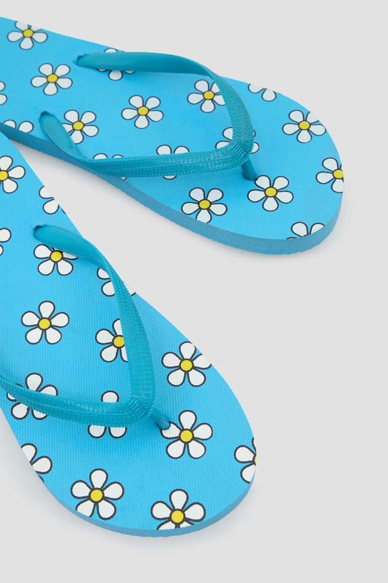 Blue patterned flip-flops